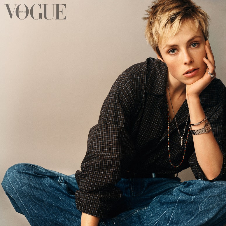 Image may contain: Edie Campbell, Clothing, Apparel, Pants, Human, Person, Sitting, Sleeve, Female, Denim, and Jeans